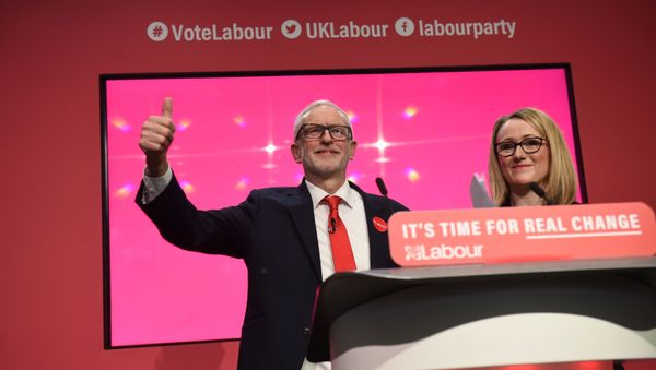 Britain's Labour Party shadow Business Secretary Rebecca Long-Bailey (R) stands with Britain's opposition Labour Party leader Jeremy Corbyn during the launch of the Labour party election manifesto in Birmingham, northwest England on November 21, 2019. Britain's Labour Party shadow Business Secretary Rebecca Long-Bailey (R) stands with Britain's opposition Labour Party leader Jeremy Corbyn during the launch of the Labour party election manifesto in Birmingham, northwest England on November 21, 2019. - Sputnik International
