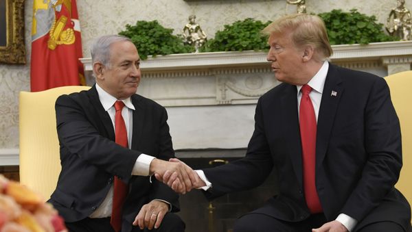 President Donald Trump, right, and Israeli Prime Minister Benjamin Netanyahu, left, shake hands in the Oval Office of the White House in Washington, Monday, March 25, 2019, at the beginning of their meeting.  - Sputnik International