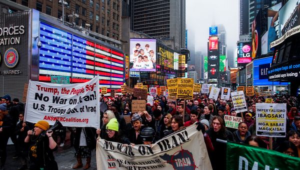 People march as they take part in an anti-war protest amid increased tensions between the United States and Iran at Times Square in New York, U.S., January 4, 2020 - Sputnik International