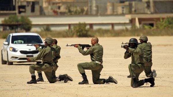 Fighters from the self-proclaimed Libyan National Army at a military academy in Libya's eastern city of Benghazi Fighters from the self-proclaimed Libyan National Army at a military academy in Libya's eastern city of Benghazi - Sputnik International