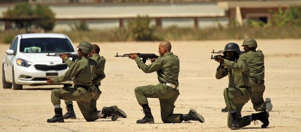 Fighters from the self-proclaimed Libyan National Army at a military academy in Libya's eastern city of Benghazi Fighters from the self-proclaimed Libyan National Army at a military academy in Libya's eastern city of Benghazi - Sputnik International