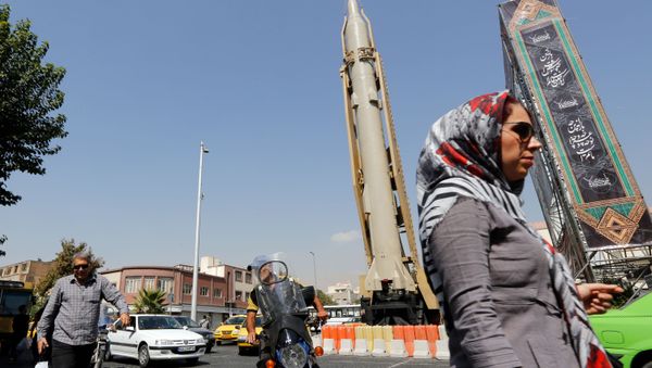 A Shahab-3 surface-to-surface missile is pictured on display in a street exhibition by Iran's army and paramilitary Revolutionary Guard celebrating  Defence Week marking the 39th anniversary of the start of 1980-88 Iran-Iraq war, at the Baharestan Square in Tehran, on September 26 2019 - Sputnik International