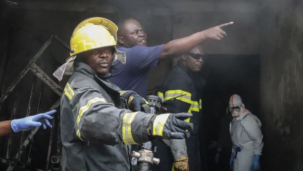 Rescuers attend the scene of an aircraft operated by private carrier Busy Bee which crashed in Goma, Congo Sunday, Nov. 24, 2019 - Sputnik International