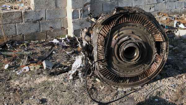 EDITORS NOTE: Graphic content / An engine lies on the ground after a Ukrainian plane carrying 176 passengers crashed near Imam Khomeini airport in the Iranian capital Tehran early in the morning on January 8, 2020, killing everyone on board - Sputnik International