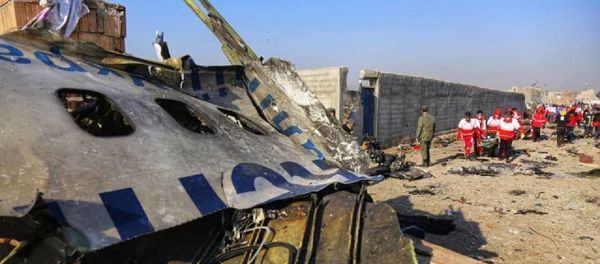 In this handout photo released by Iranian Red Crescent Society (IRCS), people work at the site of the Ukraine International Airlines' Boeing 737-800 passenger plane crash in the vicinity of the town of Parand, outside Tehran, Iran In this handout photo released by Iranian Red Crescent Society (IRCS), people work at the site of the Ukraine International Airlines' Boeing 737-800 passenger plane crash in the vicinity of the town of Parand, outside Tehran, Iran - Sputnik International