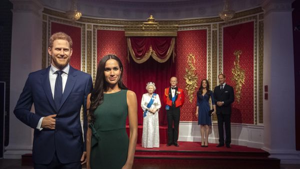 The figures of Britain's Prince Harry and Meghan, Duchess of Sussex, left, are moved from their original positions next to Queen Elizabeth II, Prince Philip and Prince William and Kate, Duchess of Cambridge, at Madame Tussauds in London, Thursday Jan. 9, 2020. Madame Tussauds moved its figures of Prince Harry and Meghan, Duchess of Sussex from its Royal Family set to elsewhere in the attraction. The figures of Britain's Prince Harry and Meghan, Duchess of Sussex, left, are moved from their original positions next to Queen Elizabeth II, Prince Philip and Prince William and Kate, Duchess of Cambridge, at Madame Tussauds in London, Thursday Jan. 9, 2020. Madame Tussauds moved its figures of Prince Harry and Meghan, Duchess of Sussex from its Royal Family set to elsewhere in the attraction. - Sputnik International