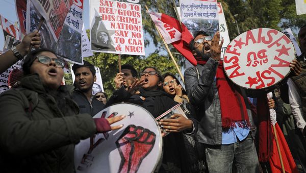 Indian students shout slogans during a protest against a recent attack on students by masked men inside Jawaharlal Nehru University, in New Delhi, India, Thursday, Jan. 9, 2020 - Sputnik International