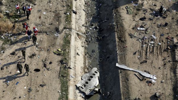 Rescue workers search the scene where a Ukrainian plane crashed in Shahedshahr, southwest of the capital Tehran, Iran Rescue workers search the scene where a Ukrainian plane crashed in Shahedshahr, southwest of the capital Tehran, Iran - Sputnik International