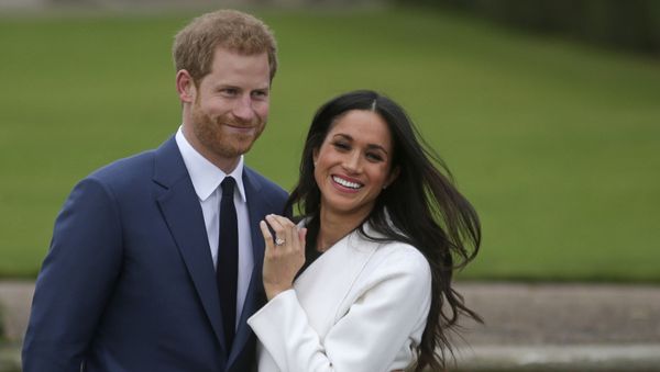 In this file photo Britain's Prince Harry stands with his fiance US actress Meghan Markle as she shows off her engagement ring whilst they pose for a photograph in the Sunken Garden at Kensington Palace in west London on November 27, 2017, following the announcement of their engagement In this file photo Britain's Prince Harry stands with his fiance US actress Meghan Markle as she shows off her engagement ring whilst they pose for a photograph in the Sunken Garden at Kensington Palace in west London on November 27, 2017, following the announcement of their engagement - Sputnik International