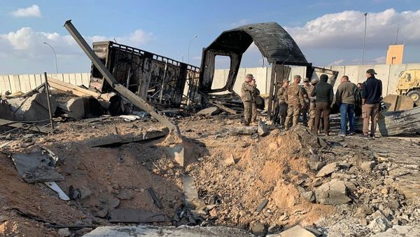 U.S. Soldiers and journalists stand near a crater caused by Iranian bombing at Ain al-Asad air base, in Anbar, Iraq, Monday, Jan. 13, 2020 - Sputnik International
