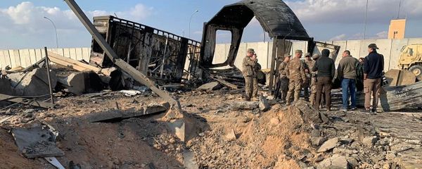 U.S. Soldiers and journalists stand near a crater caused by Iranian bombing at Ain al-Asad air base, in Anbar, Iraq, Monday, Jan. 13, 2020 - Sputnik International