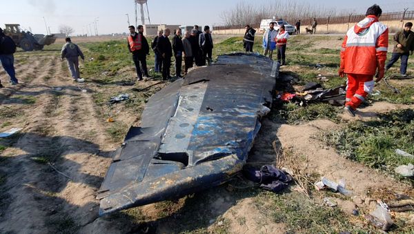 General view of the debris of the Ukraine International Airlines, flight PS752, Boeing 737-800 plane that crashed after take-off from Iran's Imam Khomeini airport, on the outskirts of Tehran, Iran January 8, 2020 is seen in this screen grab obtained from a social media video - Sputnik International
