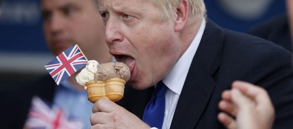 Conservative Party leadership candidate Boris Johnson eats an ice cream in Barry Island, Wales, Saturday, July 6, 2019 ahead of the Conservative party leadership hustings in Cardiff Conservative Party leadership candidate Boris Johnson eats an ice cream in Barry Island, Wales, Saturday, July 6, 2019 ahead of the Conservative party leadership hustings in Cardiff - Sputnik International