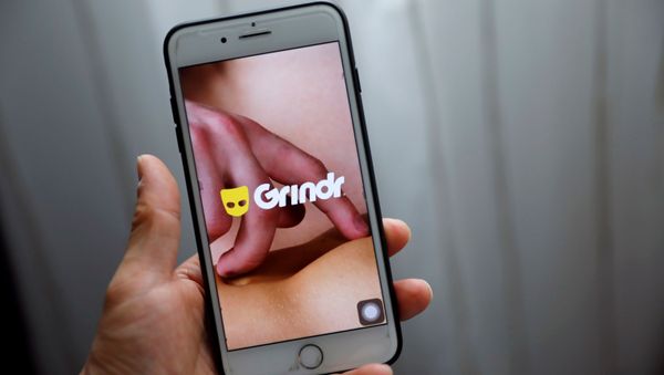 Grindr app is seen on a mobile phone in this photo illustration taken in Shanghai, China March 28, 2019.  - Sputnik International