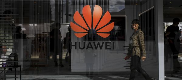 A woman walks past the logo of Chinese telecom giant Huawei during the Web Summit in Lisbon on November 6, 2019 A woman walks past the logo of Chinese telecom giant Huawei during the Web Summit in Lisbon on November 6, 2019 - Sputnik International