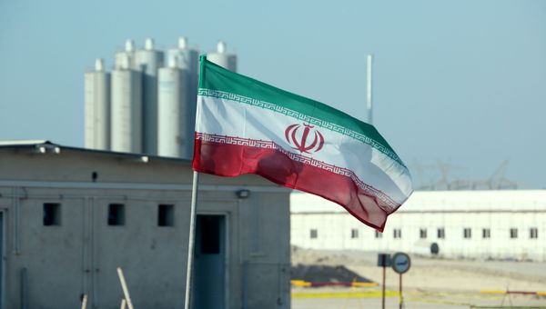 (FILES) In this file photo taken on November 10, 2019 an Iranian flag flutters in Iran's Bushehr nuclear power plant, during an official ceremony to kick-start works on a second reactor at the facility - Sputnik International