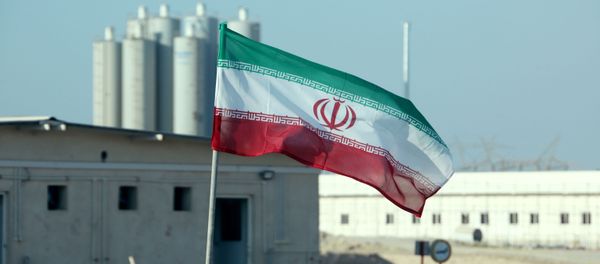 (FILES) In this file photo taken on November 10, 2019 an Iranian flag flutters in Iran's Bushehr nuclear power plant, during an official ceremony to kick-start works on a second reactor at the facility - Sputnik International