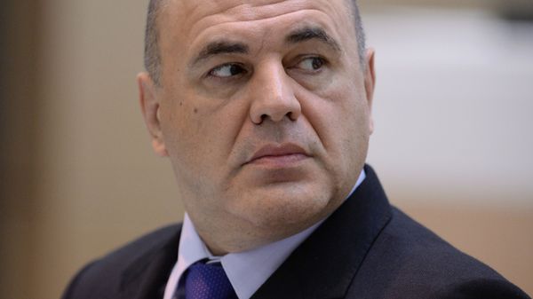 On this October 12, 2016 file photo Russia's Federal Tax Service Head Mikhail Mishustin attends a session at the Federation Council, the upper house of Russia's parliament, in Moscow, Russia. - Sputnik International