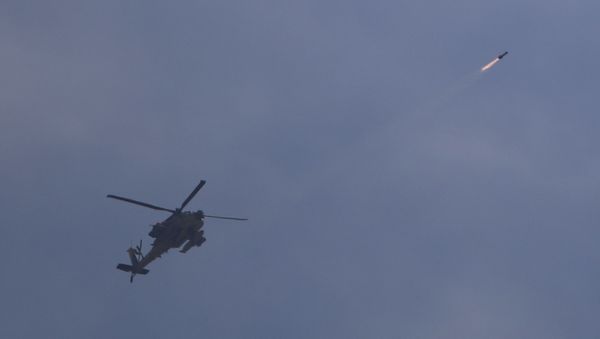 Israeli attack helicopter fires a missile into Gaza - Sputnik International
