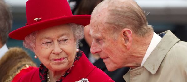Britain's Queen Elizabeth speaks to her husband Prince Philip as they attend the official re-opening of the Cutty Sark in Greenwich, London  April 25, 2012. - Sputnik International