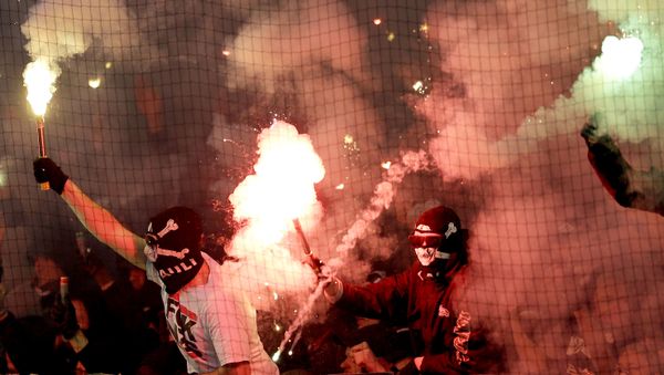 Supporters of St. Pauli light fireworks during the German soccer cup second round match between FC St. Pauli and Borussia Dortmund - Sputnik International
