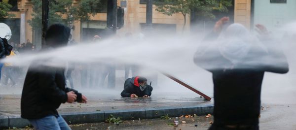 Demonstrators Are Hit by Water Cannon in Beirut Demonstrators Are Hit by Water Cannon in Beirut - Sputnik International