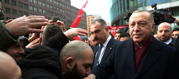 Turkish President Tayyip Erdogan is greeted by his supporters as he arrives for the Libya summit in Berlin, Germany, January 19, 2020.  - Sputnik International