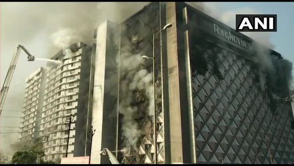 Gujarat: Latest visuals from Raghuveer Market in Surat where fire broke out, earlier today. Fire under control, cooling operation underway - Sputnik International