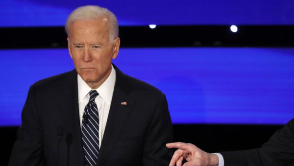 Democratic 2020 U.S. presidential candidates (L-R) former Vice President Joe Biden listens to Senator Bernie Sanders (not seen) (I-VT) at the seventh Democratic 2020 presidential debate at Drake University in Des Moines, Iowa, U.S., January 14, 2020 - Sputnik International