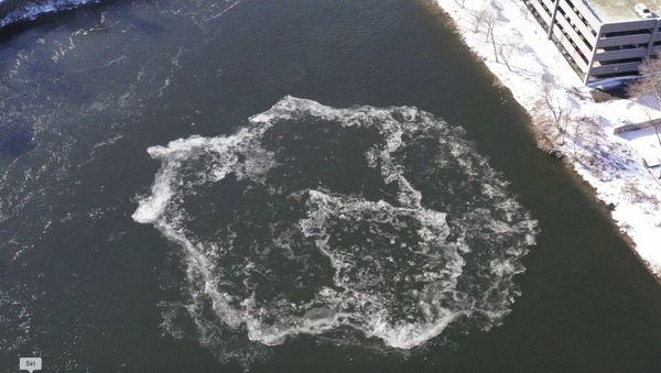 This photo provided by the city of Westbrook, Maine shows Westbrook shows an ice disk forming in the Presumpscot River in Westbrook, Maine on Jan. 17, 2020.  The formation comes just about a year after a disk measuring about 100 yards was spotted in the same river. It eventually had a devoted webcam; social media users compared it to an alien spacecraft and the moon; and ducks used it as a raft.  (Tina Radel/City of Westbrook Maine via AP) - Sputnik International