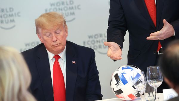 U.S. President Donald Trump listens to FIFA President Gianni Infantino speak during a dinner with global CEOs during the 50th World Economic Forum (WEF) annual meeting in Davos, Switzerland, January 21, 202 - Sputnik International