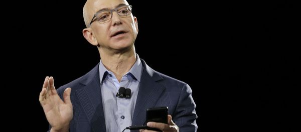 FILE - In a June 18, 2014 file photo, Amazon CEO Jeff Bezos demonstrates the new Amazon Fire Phone during a launch event, in Seattle. Blue Origin, LLC in Van Horn, Texas, the brainchild of Amazon founder Bezos, is one of two parts of the 21st-century space race being directed in the Texas by Internet billionaires FILE - In a June 18, 2014 file photo, Amazon CEO Jeff Bezos demonstrates the new Amazon Fire Phone during a launch event, in Seattle. Blue Origin, LLC in Van Horn, Texas, the brainchild of Amazon founder Bezos, is one of two parts of the 21st-century space race being directed in the Texas by Internet billionaires - Sputnik International