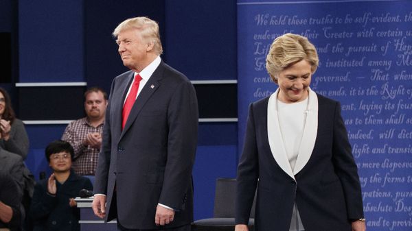 Republican presidential candidate Donald Trump, left, and Democratic presidential candidate Hillary Clinton walk to their seats after arriving for the second presidential debate at Washington University, Sunday, Oct. 9, 2016, in St. Louis Republican presidential candidate Donald Trump, left, and Democratic presidential candidate Hillary Clinton walk to their seats after arriving for the second presidential debate at Washington University, Sunday, Oct. 9, 2016, in St. Louis - Sputnik International