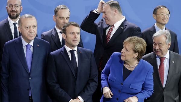 German Chancellor Angela Merkel, front second left, waits for the arrival of leaders prior to a group photo at a conference on Libya at the chancellery in Berlin, Germany, Sunday, Jan. 19, 2020.  - Sputnik International