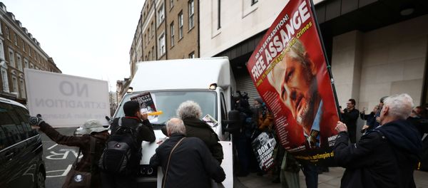 Protesters jumps in front of the prison van taking away WikiLeaks' founder Julian Assange as he leaves Westminster Magistrates Court in London, Britain January 13, 2020 Protesters jumps in front of the prison van taking away WikiLeaks' founder Julian Assange as he leaves Westminster Magistrates Court in London, Britain January 13, 2020 - Sputnik International