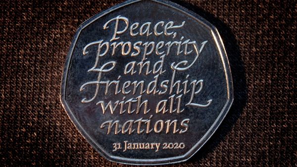 Brexit commemorative 50 pence coin that bears the words Peace, prosperity and friendship with all nations is pictured in an unknown location and uploaded to social media on January 26, 2020 Brexit commemorative 50 pence coin that bears the words Peace, prosperity and friendship with all nations is pictured in an unknown location and uploaded to social media on January 26, 2020 - Sputnik International