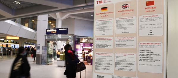 A poster with information about the coronavirus (2019-nCoV) is displayed at Tegel Airport in Berlin, Germany, January 26, 2020.   - Sputnik International
