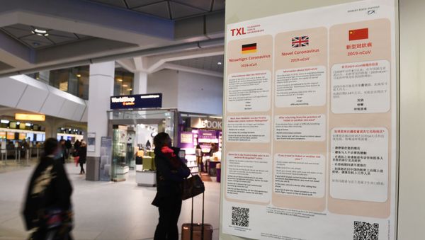 A poster with information about the coronavirus (2019-nCoV) is displayed at Tegel Airport in Berlin, Germany, January 26, 2020.   - Sputnik International