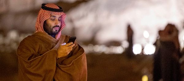 Saudi Arabia's Crown Prince Mohammed bin Salman uses his phone during a meeting with Japan's Prime Minister Shinzo Abe in Riyadh - Sputnik International