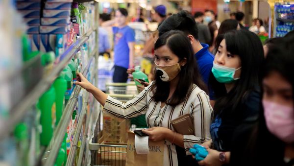 People hoard bottles of alcohol after the Philippine government confirmed the first case of the new coronavirus in the country, in Makati City, Metro Manila, Philippines, January 30, 2020 People hoard bottles of alcohol after the Philippine government confirmed the first case of the new coronavirus in the country, in Makati City, Metro Manila, Philippines, January 30, 2020 - Sputnik International