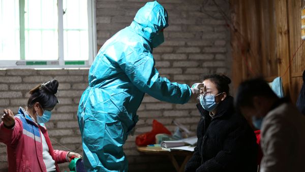 A medical worker in protective suit takes body temperature measurement of a villager as the country is hit by an outbreak of the new coronavirus, in Danzhai county, Qiandongnan Miao and Dong Autonomous Prefecture, Guizhou province, China January 31, 2020. Picture taken January 31, 2020. A medical worker in protective suit takes body temperature measurement of a villager as the country is hit by an outbreak of the new coronavirus, in Danzhai county, Qiandongnan Miao and Dong Autonomous Prefecture, Guizhou province, China January 31, 2020. Picture taken January 31, 2020. - Sputnik International