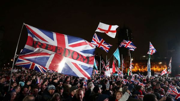 Pro-Brexit demonstrators celebrate on Parliament Square on Brexit day in London, Britain January 31, 2020.  - Sputnik International