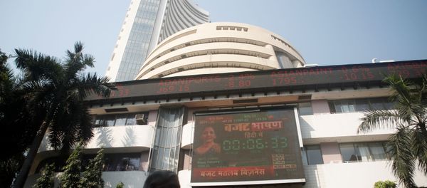 People walk past at a screen displaying India's Finance Minister Nirmala Sitharaman before the budget, on a facade of the Bombay Stock Exchange (BSE) building in Mumbai, India, February 1, 2020.  - Sputnik International