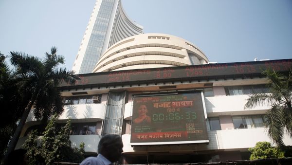 People walk past at a screen displaying India's Finance Minister Nirmala Sitharaman before the budget, on a facade of the Bombay Stock Exchange (BSE) building in Mumbai, India, February 1, 2020.  - Sputnik International