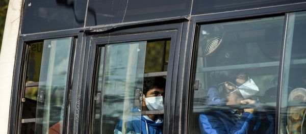 Indian nationals are transported in a bus out of the Indira Gandhi International Airport following their evacuation from the Chinese city of Wuhan, in New Delhi on February 1, 2020. Indian nationals are transported in a bus out of the Indira Gandhi International Airport following their evacuation from the Chinese city of Wuhan, in New Delhi on February 1, 2020. - Sputnik International