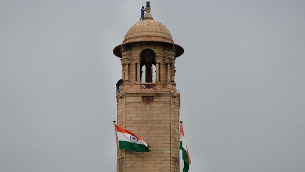 Indian workers check decorative lighting material as they work on a watch tower of The Finance Ministry in New Delhi on August 14, 2015, on the eve of the country's Independence Day celebrations. - Sputnik International