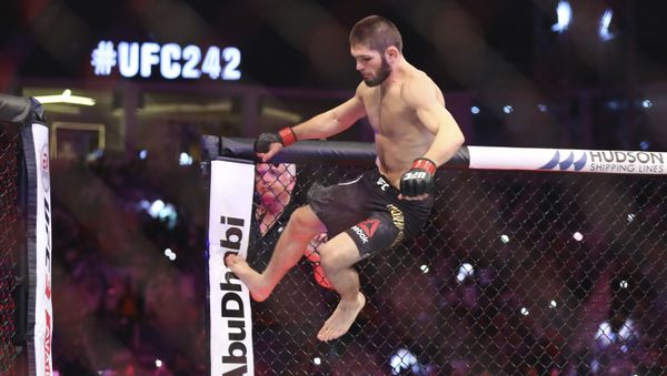 Russian UFC fighter Khabib Nurmagomedov, jumps during Lightweight title mixed martial arts bout at UFC 242, fight against UFC fighter Dustin Poirier, of Lafayette, La., in Yas Mall in Abu Dhabi, United Arab Emirates, Saturday , Sept.7 2019.  - Sputnik International