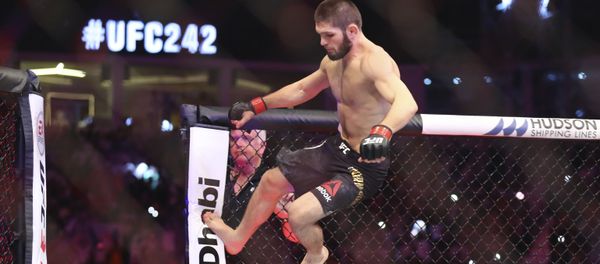 Russian UFC fighter Khabib Nurmagomedov, jumps during Lightweight title mixed martial arts bout at UFC 242, fight against UFC fighter Dustin Poirier, of Lafayette, La., in Yas Mall in Abu Dhabi, United Arab Emirates, Saturday , Sept.7 2019.  - Sputnik International
