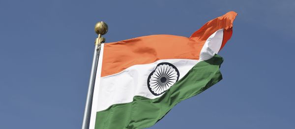 An Indian national flag is pictured before the arrival of Brazilian President Jair Bolsonaro (unseen) at the Palam Air Force station in New Delhi on January 24, 2020.  - Sputnik International