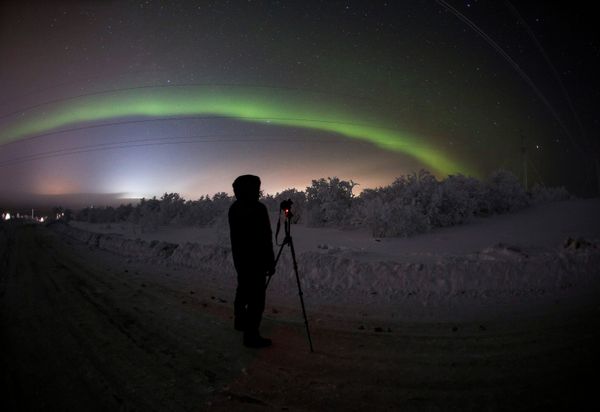 A man is photographing the northern lights in Murmansk Region, Russia. A man is photographing the northern lights in Murmansk Region, Russia. - Sputnik International